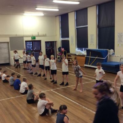 Class 10 during a dance P.E lesson on 'heros'