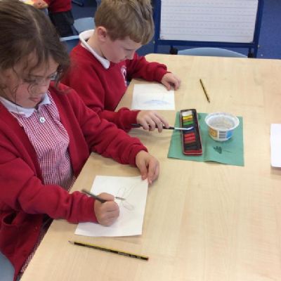 We looked carefully at a variety of butterflies and used watercolours to paint them.