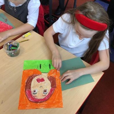 In Y4 we used oil pastels to draw self portraits