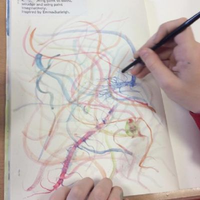 Year 4 experimenting with watercolour techniques such as 'wet on wet', flicking, using the end of brushes to make lines, bleeding and smudging and having a 'feel' for the qualities of watercolour.